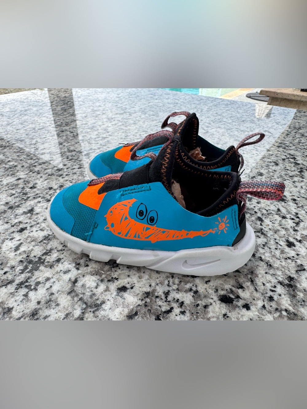 Nike Kids Teal & Orange Slip-On Sneakers with Playful Graphic